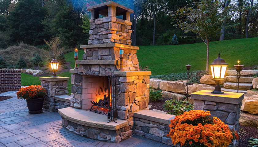 Stone Veneer Outdoor Fireplace and Paving Stone Patio