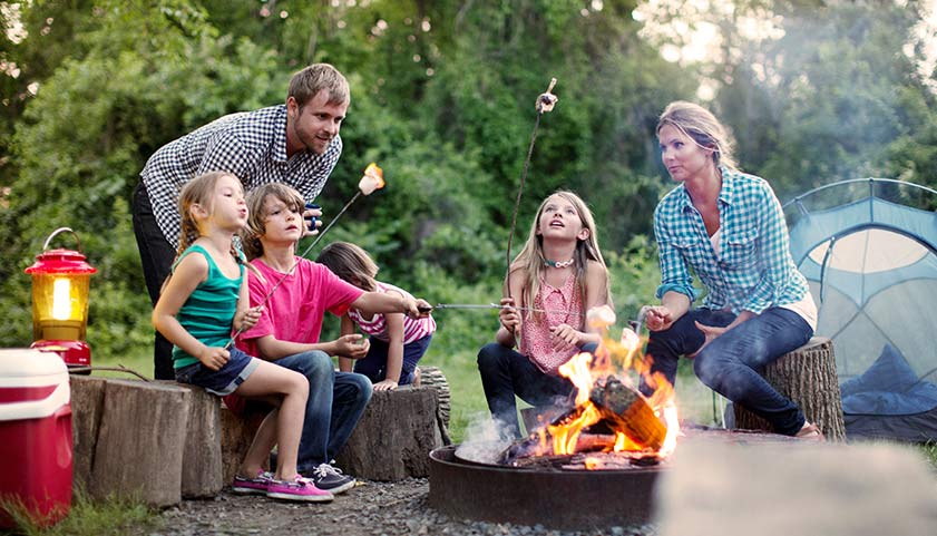 Family Outside Around Fire Pit